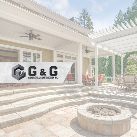 A concrete patio with G&G's logo over it