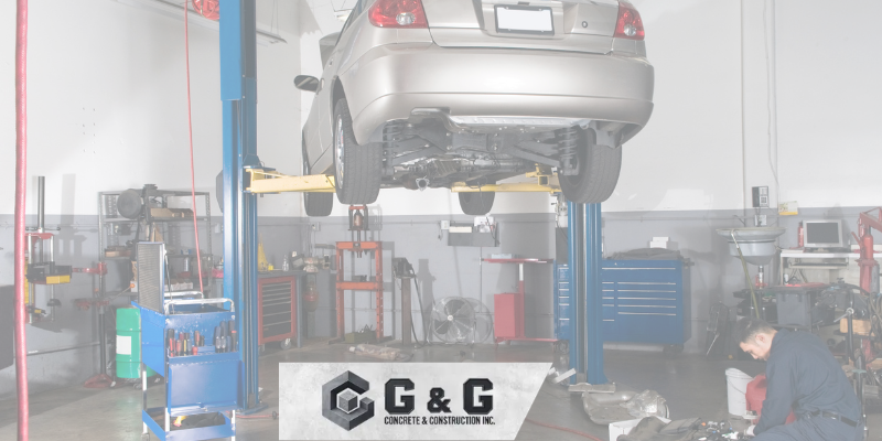 A technician operates an automotive lift.