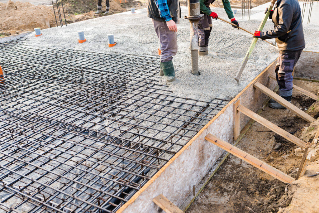 Rebar being installed over a sub-base contained within a form